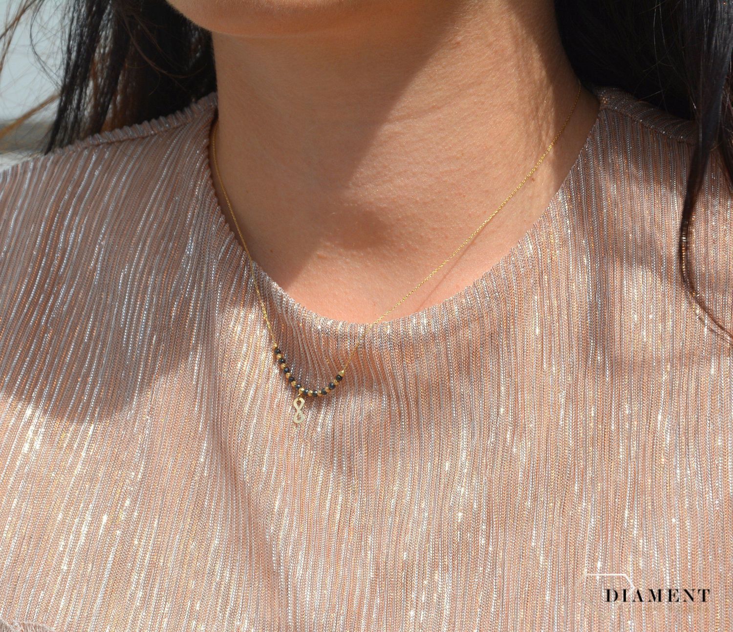 Złoty naszyjnik celebrytka 585 czarne i złote kuleczki, znak nieskończoności.jpg